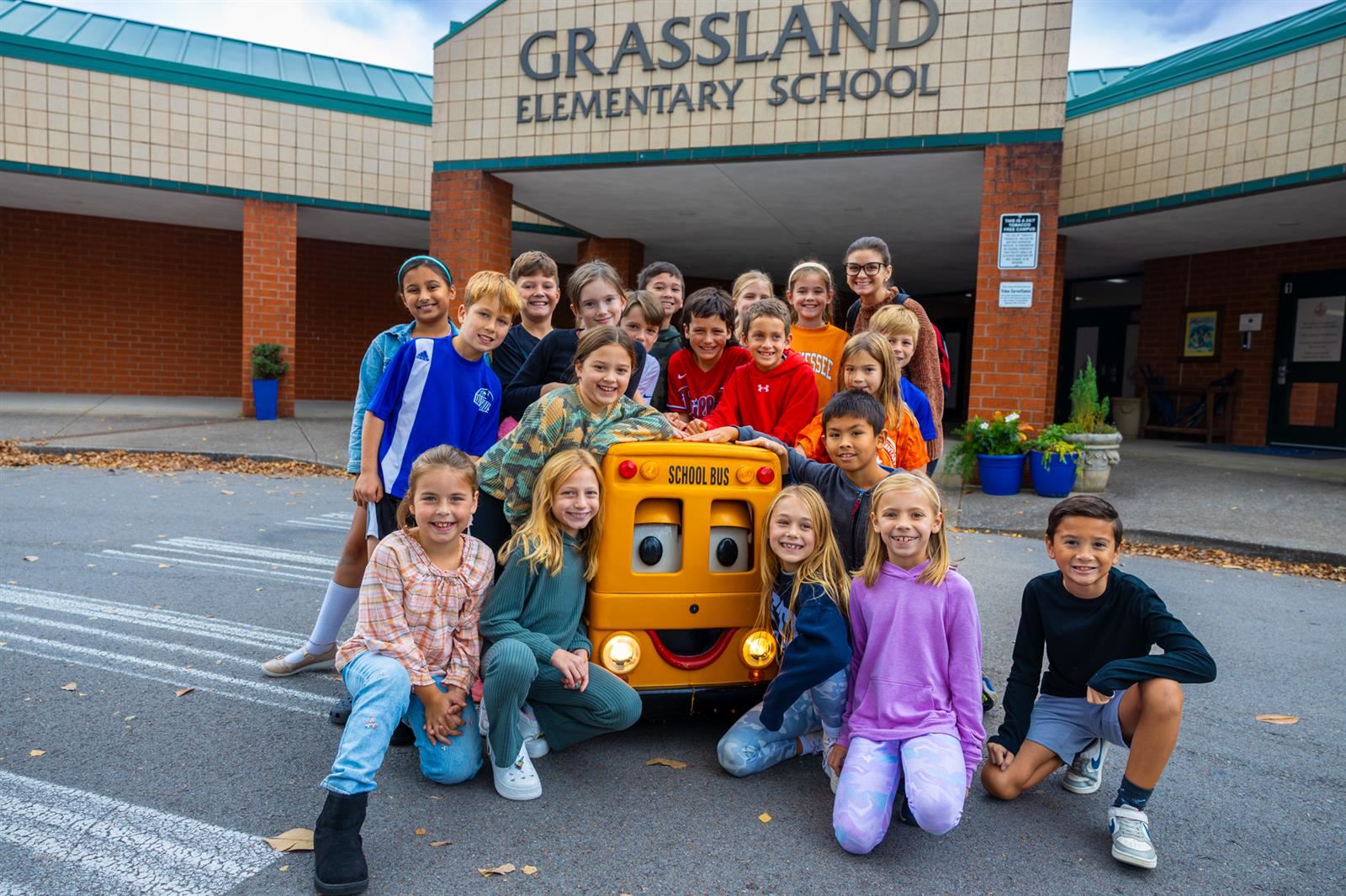 class of kids in front of GES entrance